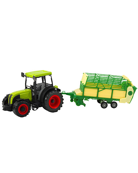 Zaļš traktors ar piekabi